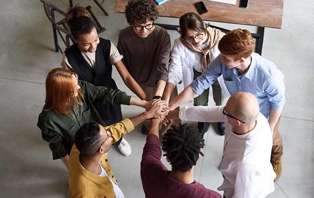 group with hands in